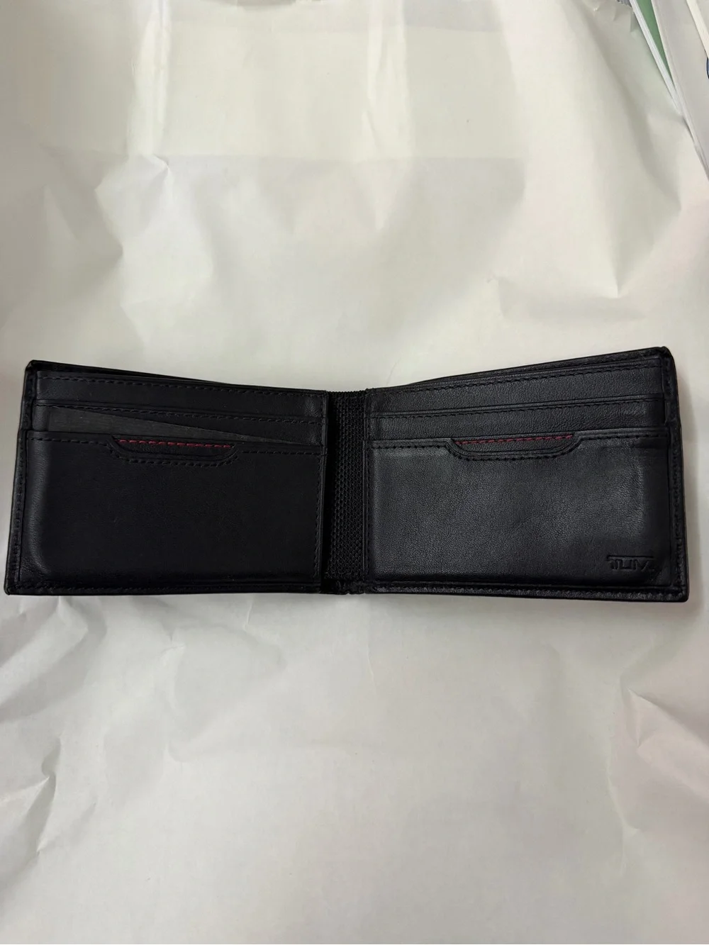 Tumi Black Leather Men's Wallet with Embossed Logo